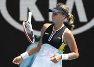 Estonia's Anett Kontaveit bounces her racket in frustration during her fourth round match against Poland's Iga Swiatek at the Australian Open tennis championship in Melbourne, Australia, Monday, Jan. 27, 2020. (AP Photo/Dita Alangkara)