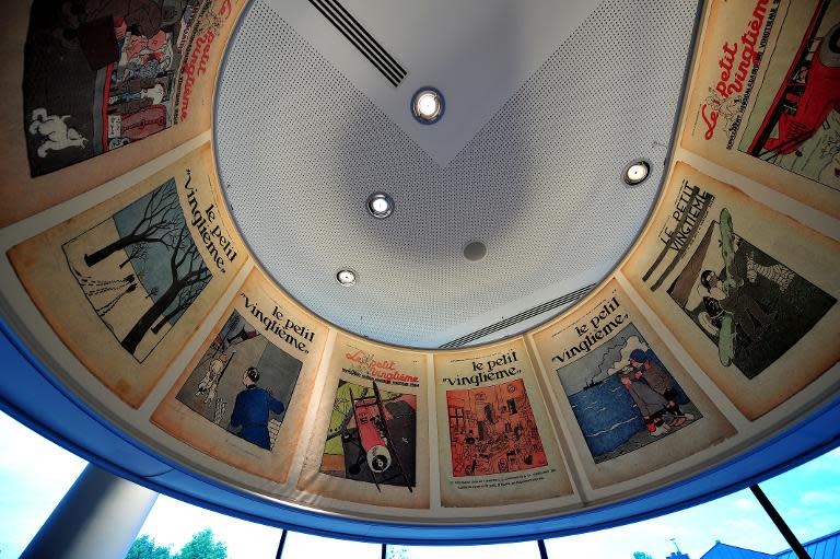 Tintin comic book covers are put on display at the Herge museum in Louvain-La-Neuve, May 22, 2014