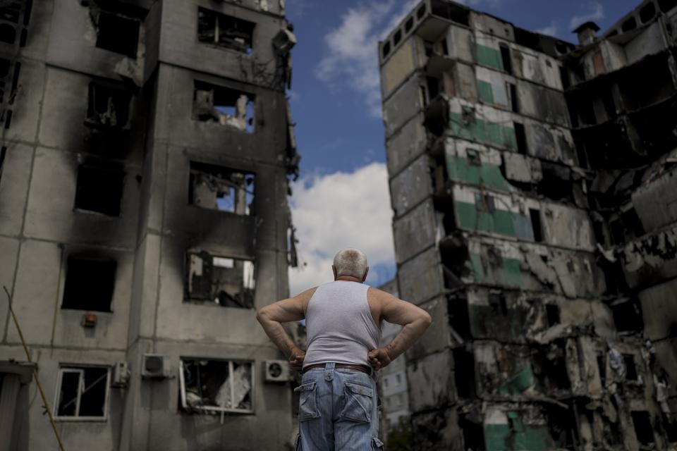 A man looks at buildings destroyed during Russian attacks on Borodyanka on the outskirts of Kyiv, Ukraine, Saturday, June 4, 2022. The image was part of a series of images by Associated Press photographers that was a finalist for the 2023 Pulitzer Prize for Feature Photography. (AP Photo/Natacha Pisarenko)