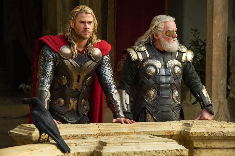 This publicity photo released by Walt Disney Studios and Marvel shows Chris Hemsworth, left, and Anthony Hopkins in a scene from "Thor: The Dark World." (AP Photo/Walt Disney Studios/Marvel, Jay Maidment)