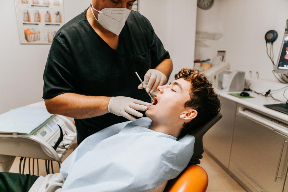 A dentist working on a patient.