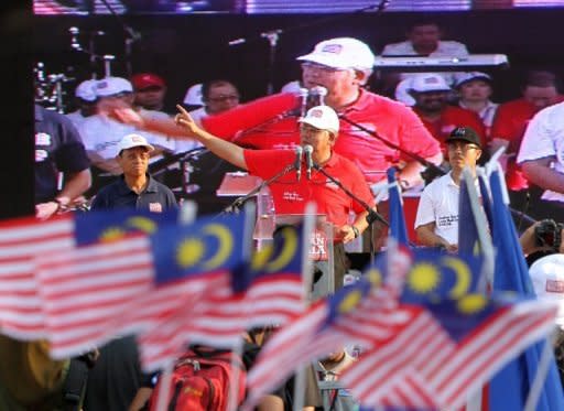 Malaysia's Prime Minister Najib Razak addresses supporters during a rally in Putrajaya in May 2012. Najib must call for polls by March next year. The opposition led by Anwar Ibrahim has set its sights on wresting power from Najib's ruling coalition Barisan Nasional