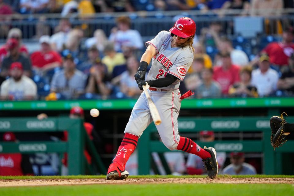 May 13, 2022; Pittsburgh, Pennsylvania, USA; Cincinnati Red right fielder TJ Friedl (29) hits an infield single against the Pittsburgh Pirates during the fifth inning at PNC Park. Mandatory Credit: Gregory Fisher-USA TODAY Sports