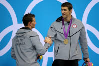 <b>Medal No. 20</b><br>Gold medalist Michael Phelps (R) of the United States shakes hands with Silver medalist Ryan Lochte of the United States on the podium during the medal ceremony for the Men's 200m Individual Medley final on Day 6 of the London 2012 Olympic Games at the Aquatics Centre on August 2, 2012 in London, England. (Photo by Ezra Shaw/Getty Images)