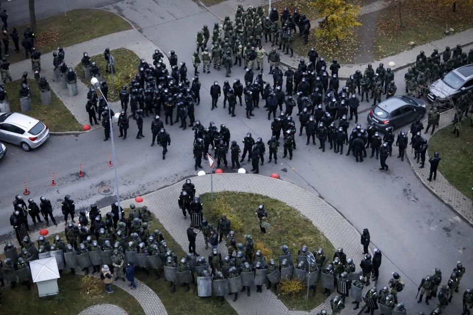 Belarusian riot police block the road to stop demonstrators during an opposition rally to protest the official presidential election results in Minsk, Belarus, Sunday, Nov. 15, 2020. A Belarusian human rights group says more than 500 people have been arrested in protests around the country calling for authoritarian President Alexander Lukashenko to step down. The Sunday demonstrations continued to wave of near-daily protests that have gripped Belarus since early August. (AP Photo)