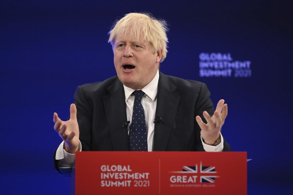 Prime Minister Boris Johnson delivers a speech during the Global Investment Summit at the Science Museum, London, Tuesday, Oct, 19, 2021. (Leon Neal/Pool Photo via AP