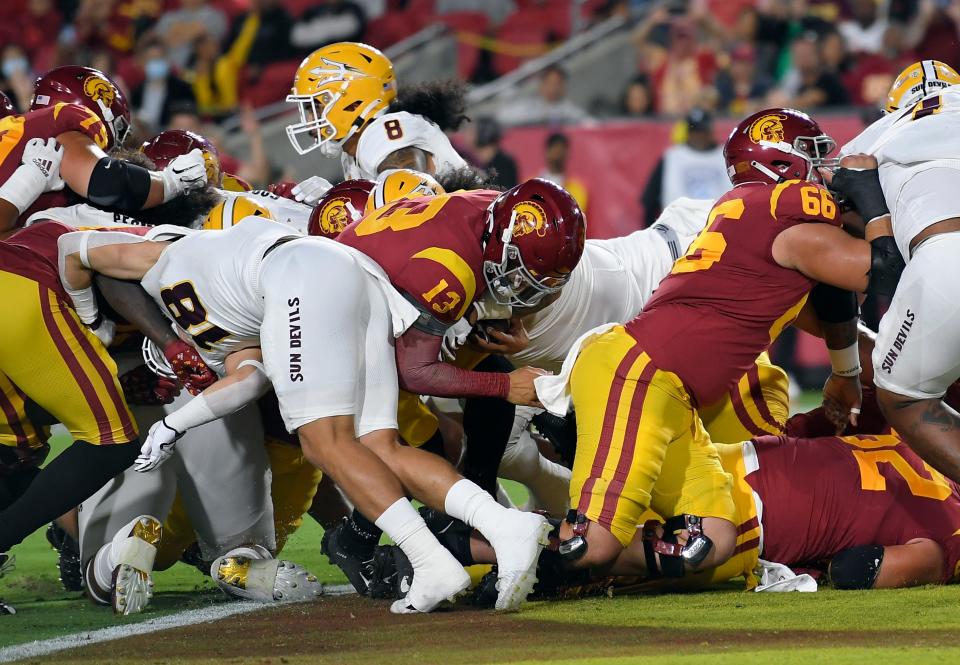 Caleb Williams #13 of the USC Trojans scores a touchdown against the Arizona State Sun Devils during the first half at United Airlines Field at the Los Angeles Memorial Coliseum on October 1, 2022 in Los Angeles, California.