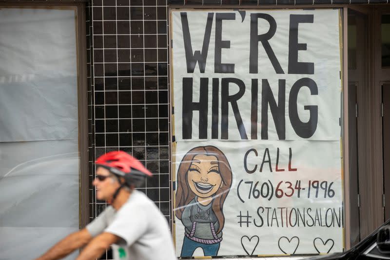 FILE PHOTO: A new business advertises for workers as it prepares to open up during the outbreak of the coronavirus disease in California,