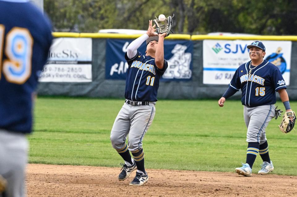 Monache's Tyson Chavez fields a hit ball against Redwood in an East Yosemite League baseball game on Tuesday, March 28, 2023. 