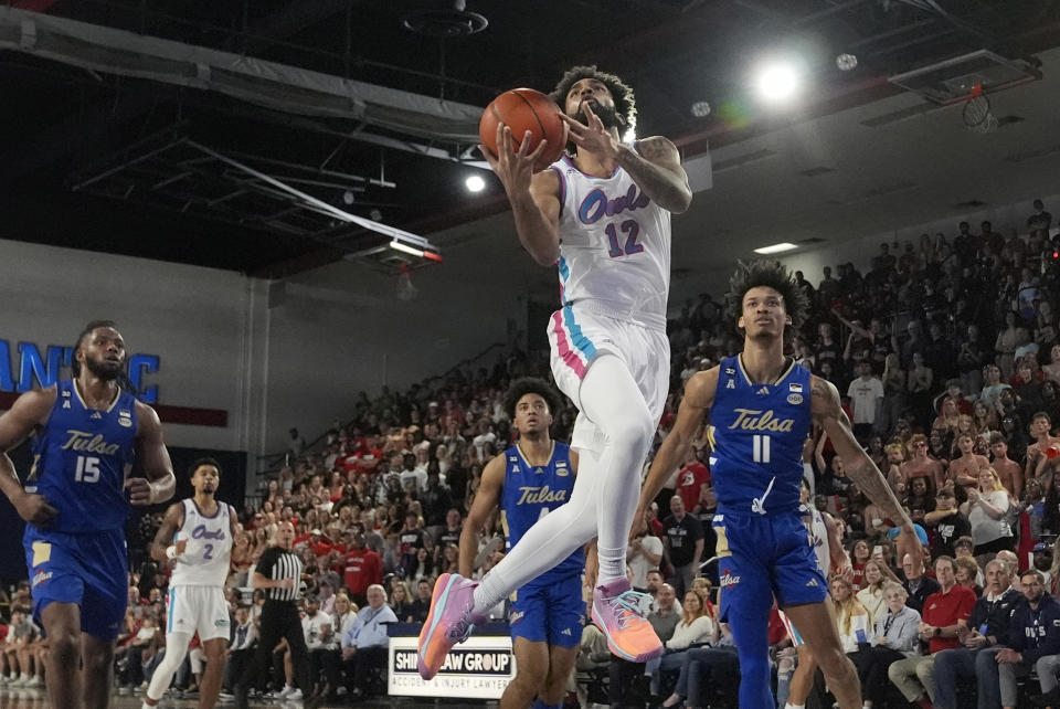 Florida Atlantic guard Jalen Gaffney (12) drives to the basket during the first half of an NCAA college basketball game against Tulsa, Saturday, Feb. 3, 2024, in Boca Raton, Fla. (AP Photo/Marta Lavandier)