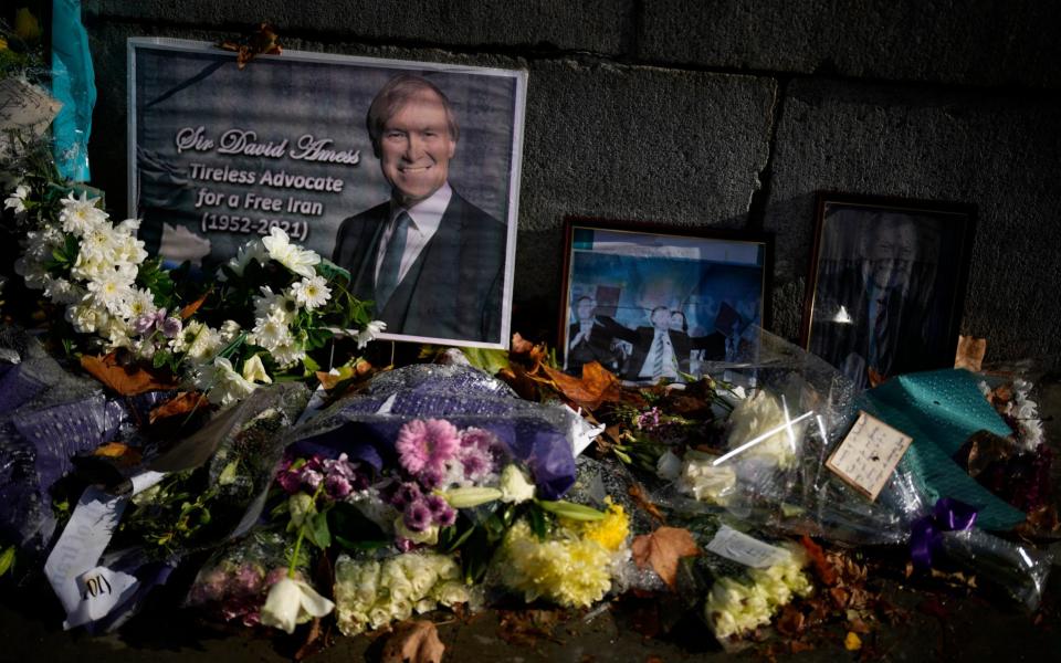 Tributes to Sir David Amess placed outside the Houses of Parliament - Matt Dunham/AP