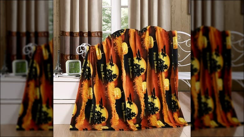 Halloween-patterned blanket in house
