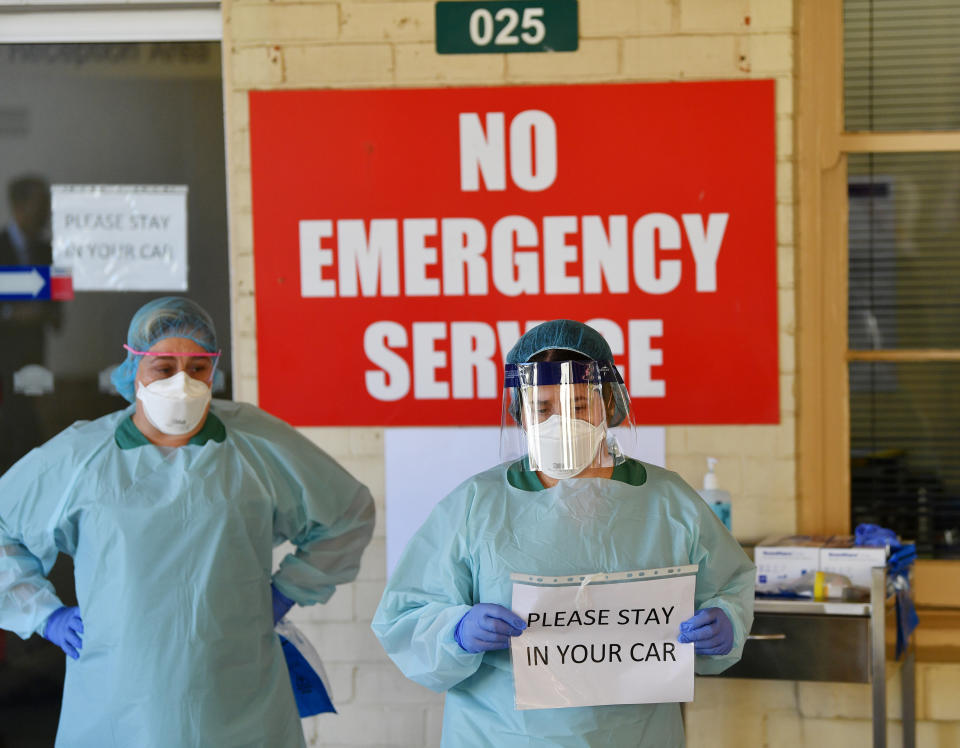 Two female medical staff wear PPE at a South Australian hospital. Source: AAP