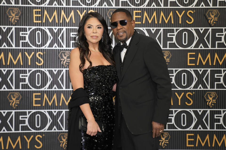 Angie Gonzales, left, and Martin Lawrence arrive at the 75th Primetime Emmy Awards on Monday, Jan. 15, 2024, at the Peacock Theater in Los Angeles. (AP Photo/Ashley Landis)