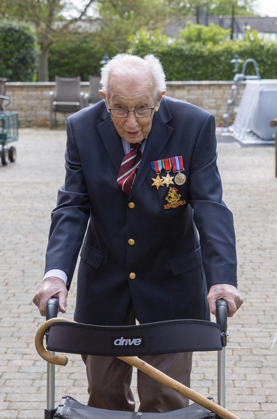 Undated family handout photo of Tom Moore, a 99-year-old British veteran who has started a campaign to thank the National Health Service by walking lengths in his garden. Captain Tom Moore’s family had set up a fund-raising drive to support health workers caring for coronavirus patients, as a way to thank doctors and nurses who treated him for a broken hip. The family thought they would struggle to reach their initial 1,000-pound target last week. But the campaign clearly captured the public mood at a time of national crisis and within days, the cause had attracted more than 250,000 supporters who pledged more than 6 million pounds. (Moore Family via AP)