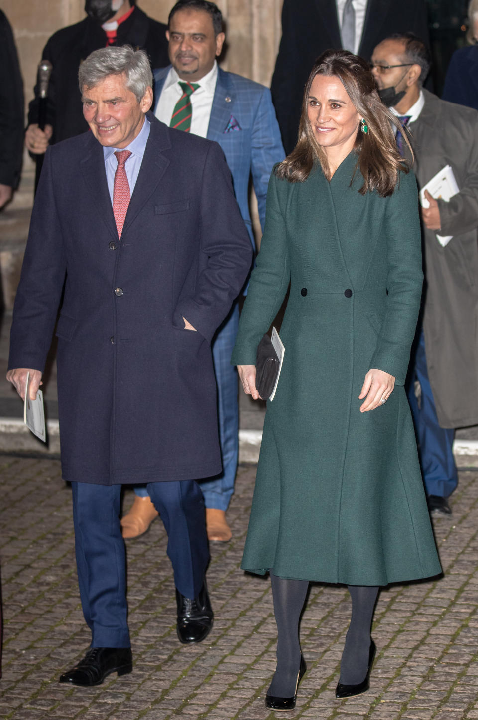 Pippa Middleton wearing a long green coat and a pair of patent leather pumps at the ‘Together At Christmas’ carol service at Westminster Abbey in London. - Credit: John Rainford / SplashNews.com