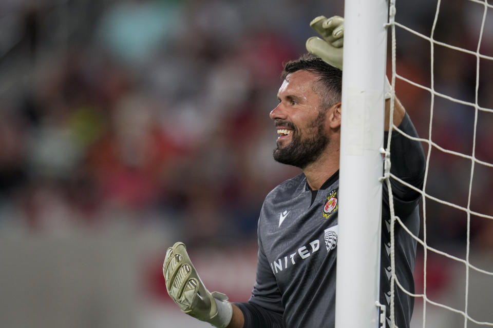 Wrexham goalkeeper Ben Foster reacts during the first half of a club friendly soccer match against Manchester United, Tuesday, July 25, 2023, in San Diego. (AP Photo/Gregory Bull)