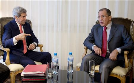 U.S. Secretary of State John Kerry (L) and Russia's Foreign Minister Sergei Lavrov sit together during a photo opportunity prior to a meeting, in Geneva November 23, 2013. REUTERS/Carolyn Kaster/Pool