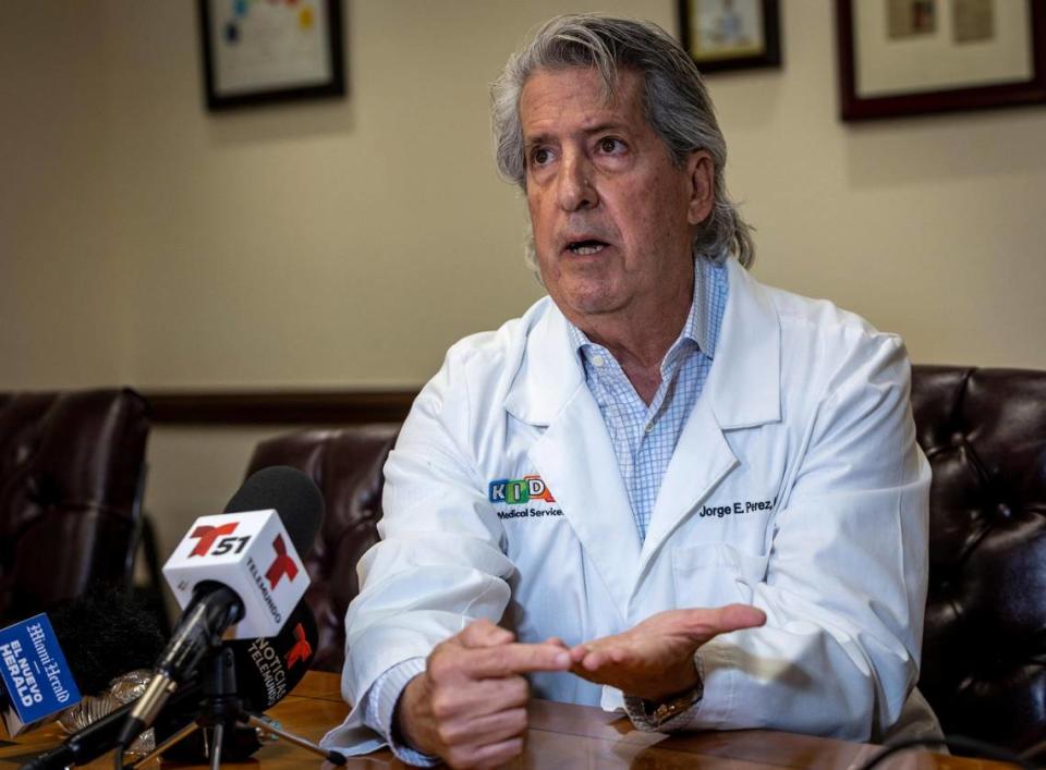 Dr. Jorge Perez points to his hand to illustrate the size of the premature baby born aboard a cruise ship as he answers questions from reporters during a press conference held at Kidz Medical Services, in Coral Gables, FL. Dr. Jorge E. Perez, a renowned neonatologist based in Miami was on the phone with the medical team of a cruise ship all night trying to save the lives of a prematurely born infant and his mother.