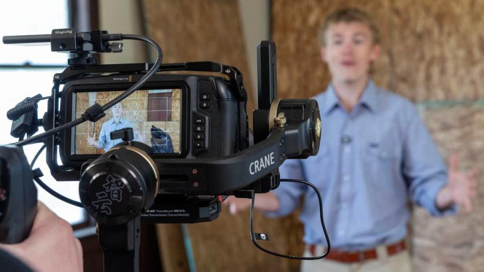 Boise State media student Jake Zahm, host of a documentary featuring the restoration of the Opaline Schoolhouse, is recorded by fellow students as he describes some of the challenges the project faces.