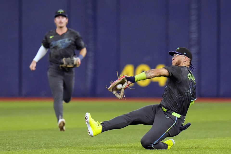 Tampa Bay Rays right fielder Harold Ramirez makes a sliding catch on a fly out by New York Mets' Pete Alonso during the fourth inning of a baseball game Friday, May 3, 2024, in St. Petersburg, Fla. (AP Photo/Chris O'Meara)