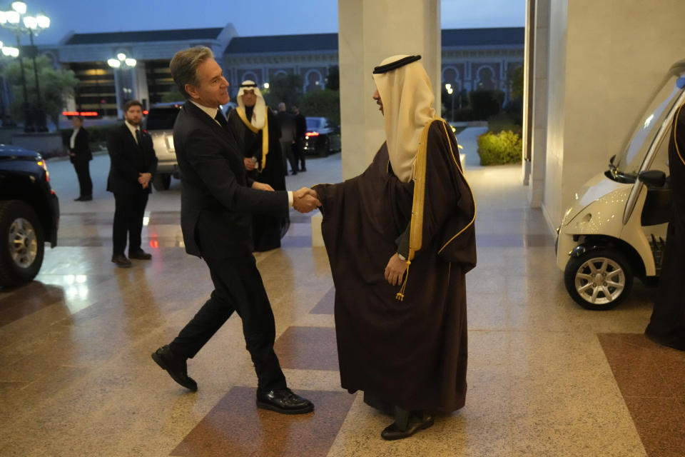 US Secretary of State Antony Blinken is greeted by Saudi Arabia's Foreign Minister Prince Faisal bin Farhan Al-Saud, in Riyadh, Saudi Arabia, Monday, Feb. 5, 2024. (AP Photo/Mark Schiefelbein, Pool)