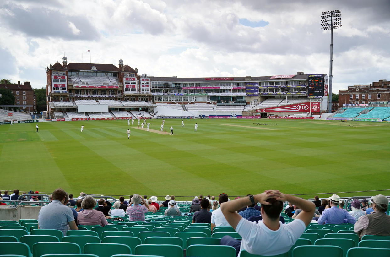 Spectators watch the action from the stands during the friendly match at the Oval on Sunday. (PA)