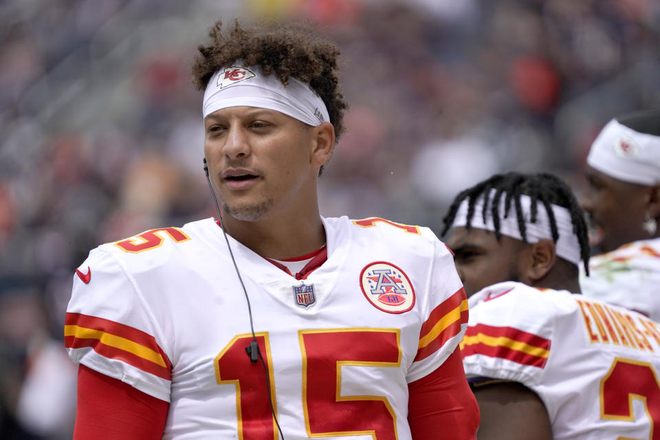 Kansas City Chiefs quarterback Patrick Mahomes listens to the play calls during the first half of an NFL preseason football game against the Chicago Bears Saturday, Aug. 13, 2022, in Chicago. (AP Photo/David Banks)