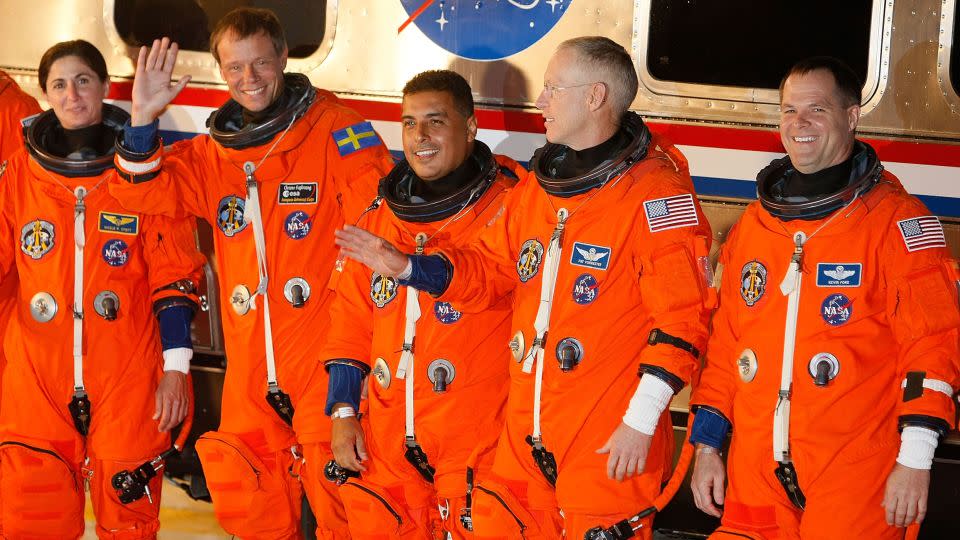 Space shuttle Discovery crew members, Mission Specialists Nicole Stott, Christer Fuglesang, Jose Hernandez and Patrick Forrester along with Pilot Kevin Ford as they prepare to head to the launch pad from the Kennedy Space Center in Cape Canaveral, Florida, on August 28, 2009. - Joe Raedle/Getty Images