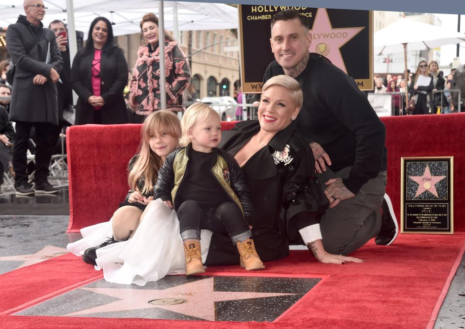 Pink poses with husband Carey Hart and children Willow and Jameson at a ceremony honoring her with a star on the Hollywood Walk of Fame in 2019.