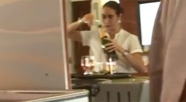 The woman appears to pour wine back into a bottle. Source: Streamable