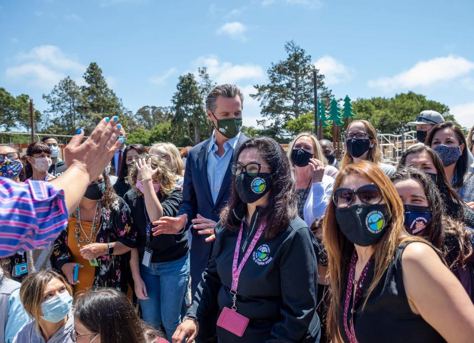 Gov. Gavin Newsom, talks with North Monterey County Unified School District employees during a press conference at Elkhorn Elementary School in Castroville, Calif., on Wednesday, May 12, 2021. 