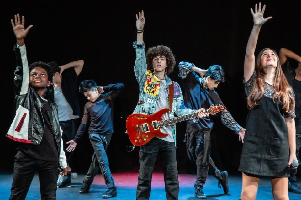 D’Corey Johnson, left, JJ Carandang, Matthew Jost, Jaaziah Vallano and Mia Leberknight perform in "HITS! The Musical," which will be at the Morris Performing Arts Center in South Bend on April 16, 2023.