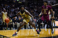 Purdue forward Trevion Williams (50) drives on Florida State guard Cam'Ron Fletcher (21) during the second half of an NCAA college basketball game in West Lafayette, Ind., Tuesday, Nov. 30, 2021. Purdue defeated Florida State 93-65. (AP Photo/Michael Conroy)