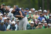 Jon Rahm, of Spain, hits on the 12th hole during a practice round in preparation for the Masters golf tournament at Augusta National Golf Club Tuesday, April 9, 2024, in Augusta, Ga. (AP Photo/Matt Slocum)