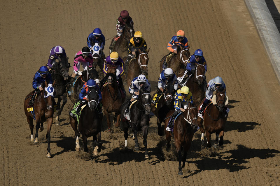 Horses run the 149th running of the Kentucky Oaks horse race at Churchill Downs Friday, May 5, 2023, in Louisville, Ky. (AP Photo/Charlie Riedel)