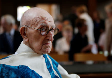 Father Jacques Clemens attends a mass at St. Benoit church in Nalinnes, Belgium, July 10, 2016. REUTERS/Francois Lenoir