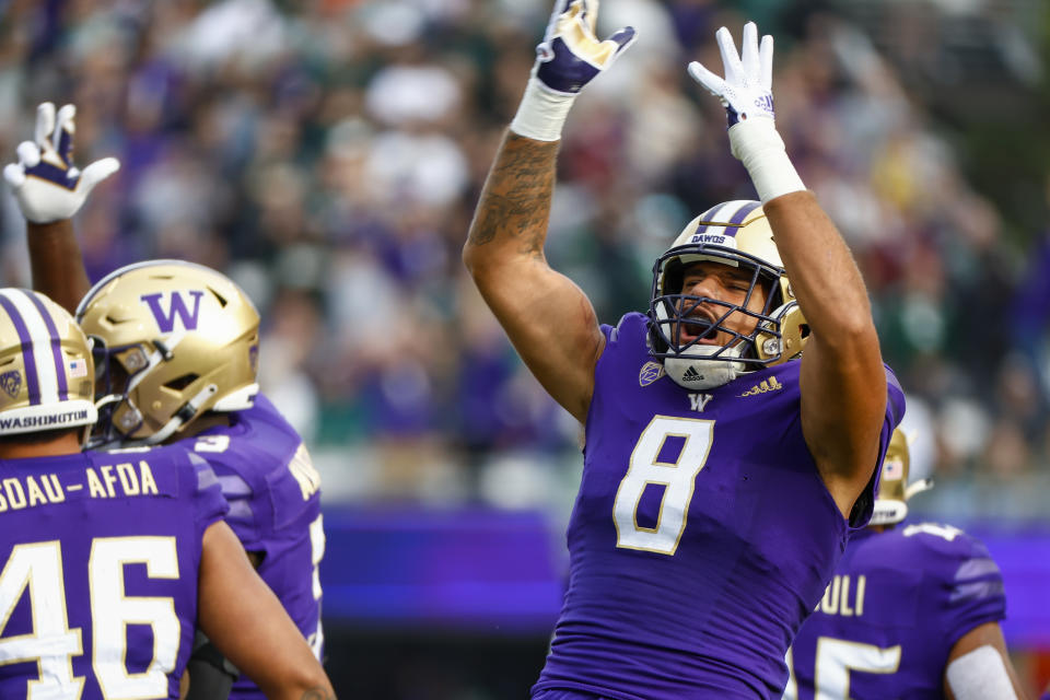 Sep 17, 2022; Seattle, Washington, USA; Washington Huskies defensive lineman Bralen Trice (8) celebrates a safety against the Michigan State Spartans during the first quarter at Alaska Airlines Field at Husky Stadium. Mandatory Credit: Joe Nicholson-USA TODAY Sports