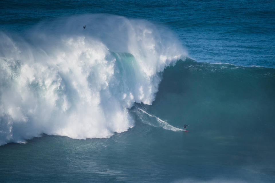 NAZARE, PORTUGAL - 2020/10/29: Big wave surfer Justine Dupont from France rides a wave during a tow surfing session at Praia do Norte on the first big swell of winter season. (Photo by Henrique Casinhas/SOPA Images/LightRocket via Getty Images)