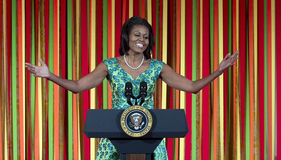 michelle speaking at a podium