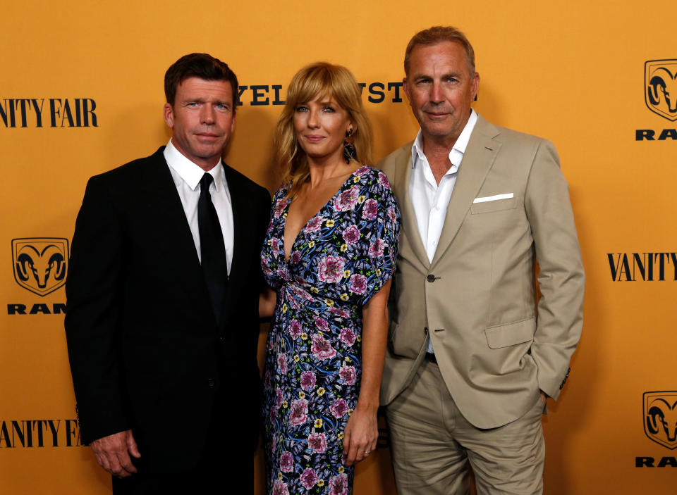 Creator, director and executive producer Taylor Sheridan (L) poses with cast members Kevin Costner and Kelly Reilly at a premiere for the television series 