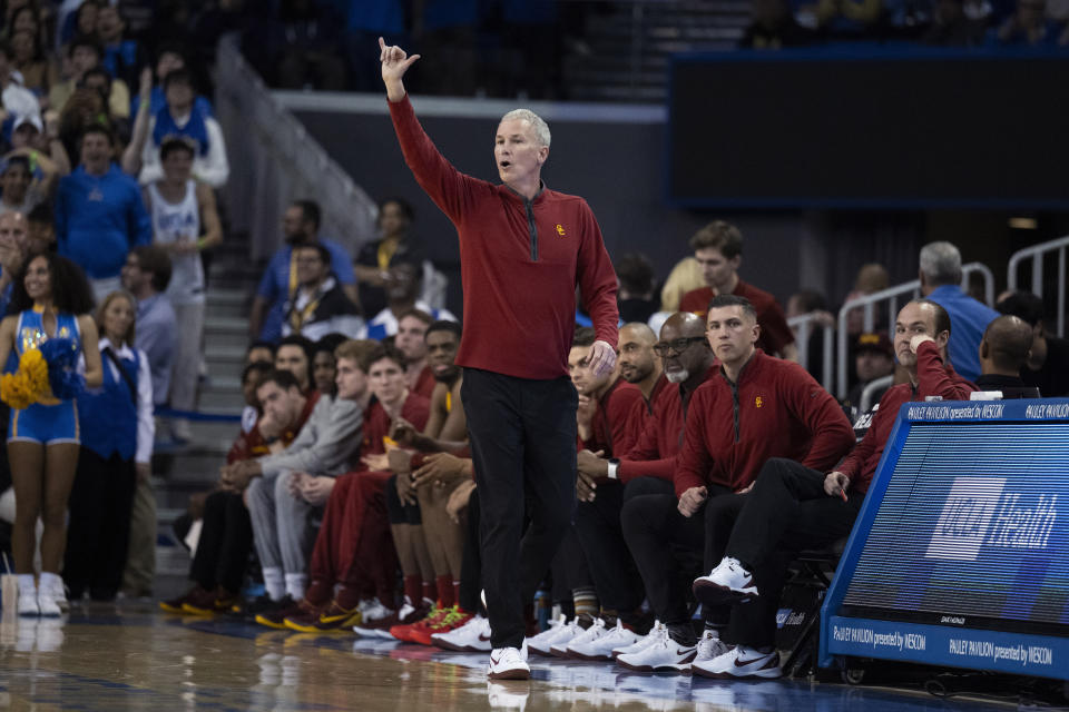 Southern California coach Andy Enfield gives instructions to players during the first half of the team's NCAA college basketball game against UCLA, Saturday, Feb. 24, 2024 in Los Angeles. (AP Photo/Kyusung Gong)