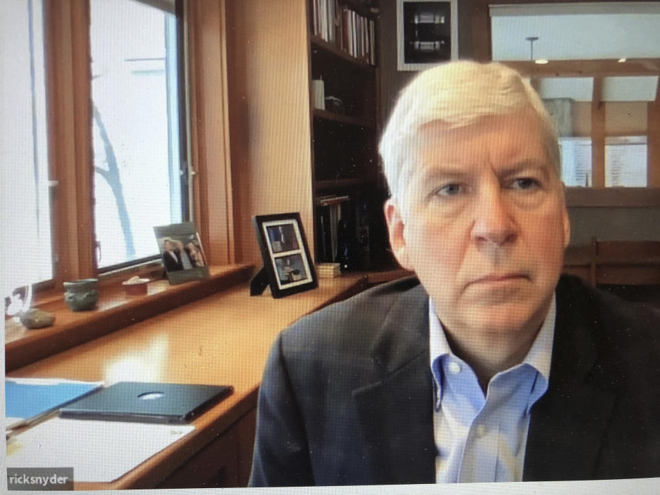 This screen shot from video, shows former Michigan Gov. Rick Snyder, during his Zoom hearing Tuesday, Jan. 18, 2020, in 67th District Court in Flint, Mich. Attorneys for Snyder are telling prosecutors that the Flint water case should be dismissed because he was charged in the wrong county. Snyder was charged last week with two misdemeanor counts of willful neglect of duty. (67th District Court in Flint via AP)