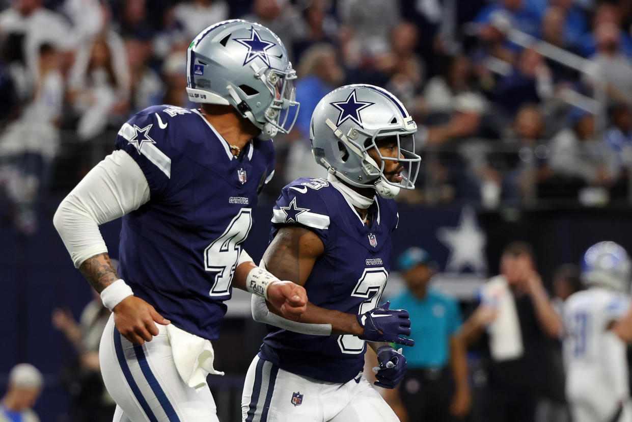 ARLINGTON, TEXAS - DECEMBER 30: Quarterback Dak Prescott #4 of the Dallas Cowboys and wide receiver Brandin Cooks #3 run back to the sideline after a touchdown against the Detroit Lions at AT&T Stadium on December 30, 2023 in Arlington, Texas. (Photo by Richard Rodriguez/Getty Images)