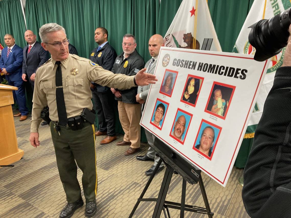 Tulare County Sheriff Sheriff Mike Boudreaux during a news conference in Visalia on Tuesday, Jan. 17, 2023, points to the victims of a mass shooting on Monday in Goshen: Eladio Parraz, 52; Marcos Parraz, 19; Jennifer Analla, 49; Rosa Parraz, 72; Elyssa Parraz, 16; and Nycholas Parraz, 10-months-old. LEWIS GRISWOLD/Special to The Bee