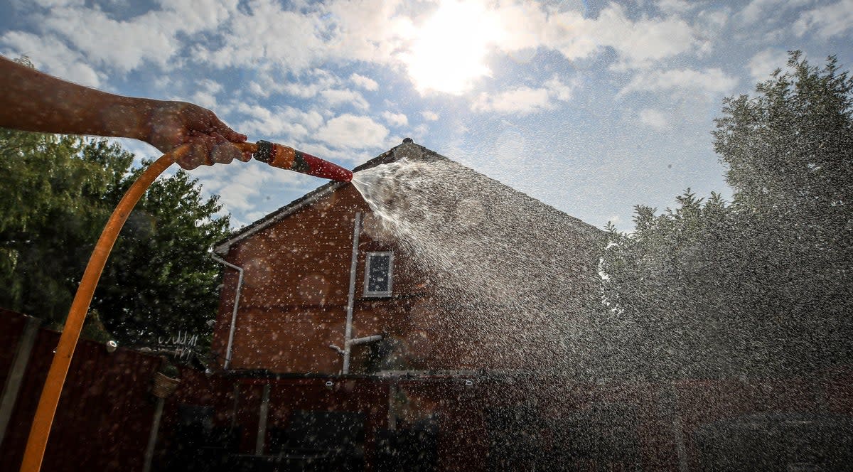 Hosepipe attached to a water tap. People are being urged to use water wisely as England faces drought in August (Peter Byrne/PA) (PA Archive)