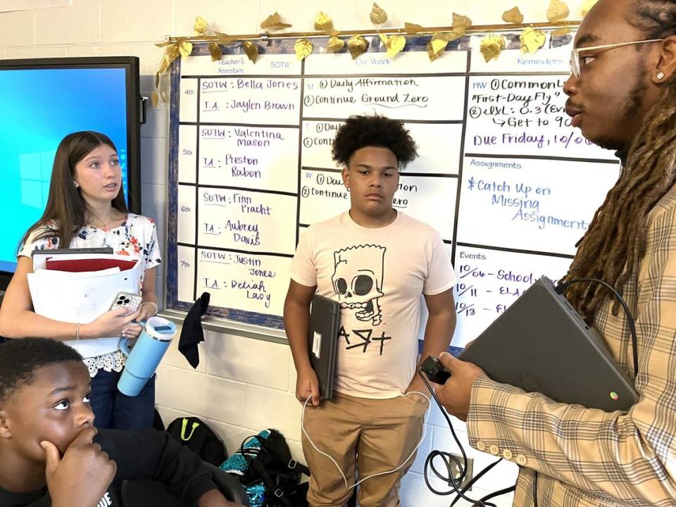 Harris County Carver Middle School English language arts teacher Jalin Murphy talks with students after one of his classes Oct. 5, 2023. Murphy is the Harris County School District 2023 Teacher of the Year. Mark Rice/mrice@ledger-enquirer.com