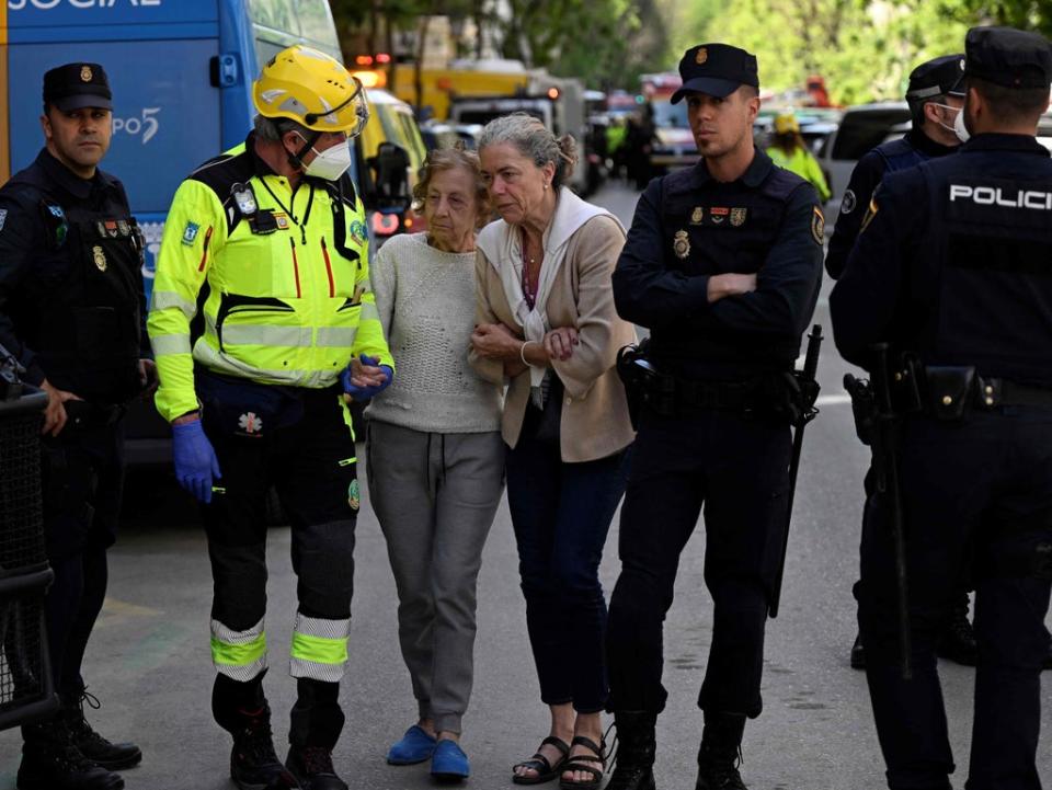 Police helped residents shaken by the blast (AFP via Getty Images)