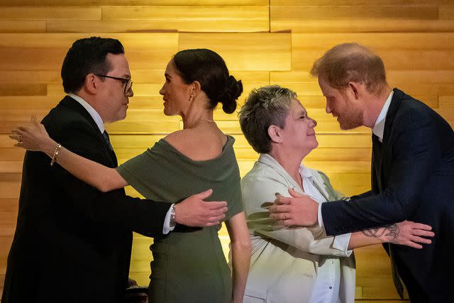 <p>Ethan Cairns/The Canadian Press via AP</p> Squamish Nation Councillor Wilson Williams, left; Meghan Markle; Chief of the Tsleil-Waututh Nation, Jen Thomas; and Prince Harry exchange greetings after being given blankets during the "One Year to Go" Invictus Games dinner in Vancouver, British Columbia, Friday, Feb. 16, 2024.