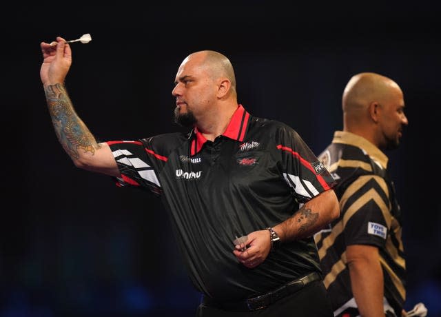 Raymond Smith in action against Devon Petersen at the PDC World Darts Championship